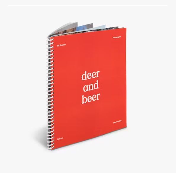 a red spiral bound book titled deer and beer