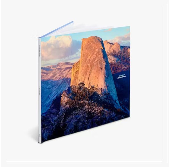 a book with a picture of a mountain on the cover .