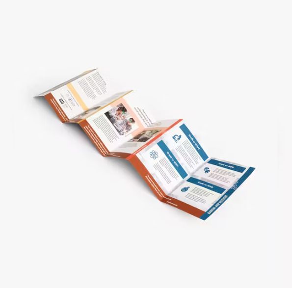 a folded brochure is sitting on a white surface .