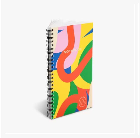 a spiral notebook with a colorful design on it