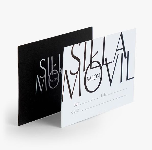 a black and white business card for stella salon