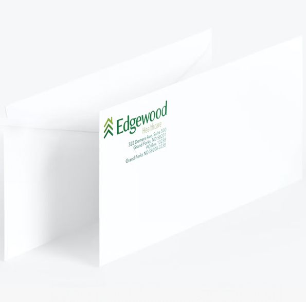 a white envelope with a green edgewood logo on it .