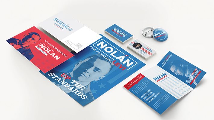 a collection of political posters , brochures , buttons , and business cards .