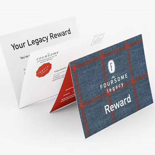 a foursome legacy reward card is sitting on a table .