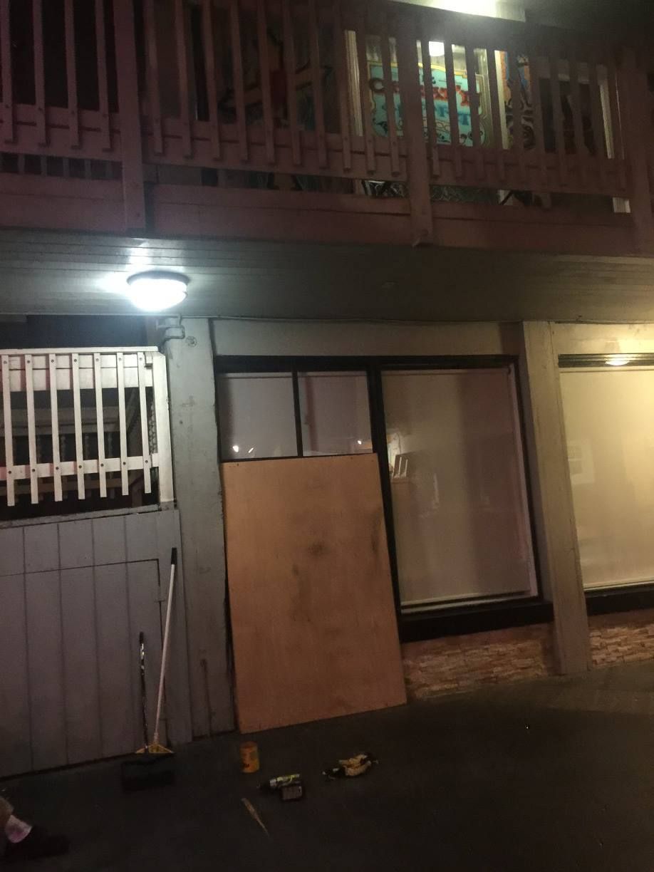 A building with a balcony and a wooden fence