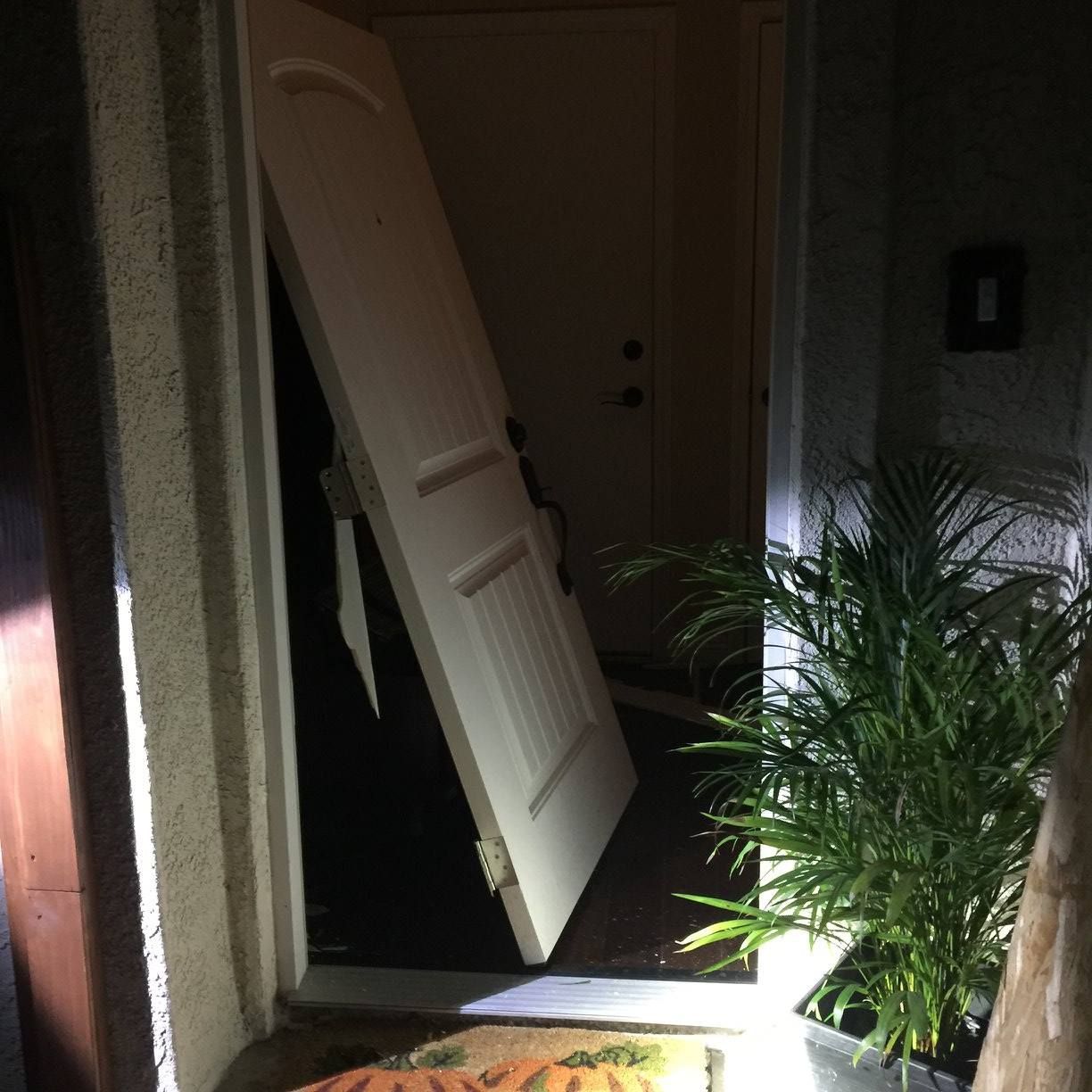 A door with the letter b on the wall behind it