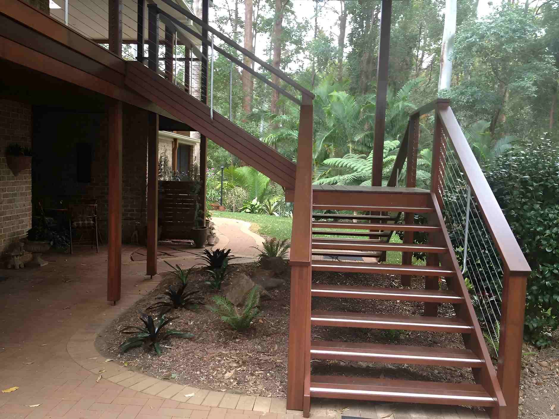 A Wooden Deck With Stairs Leading Up to It — D.J. Decks in Bellingen, NSW