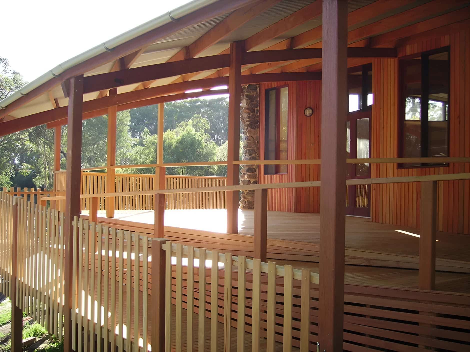 A Wooden Deck With a Fence Surrounding It — D.J. Decks in Sapphire Beach, NSW
