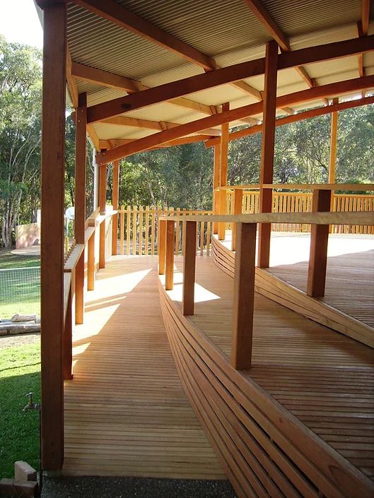 A Wooden Deck With a Ramp Leading to It  — D.J. Decks in Sawtell, NSW