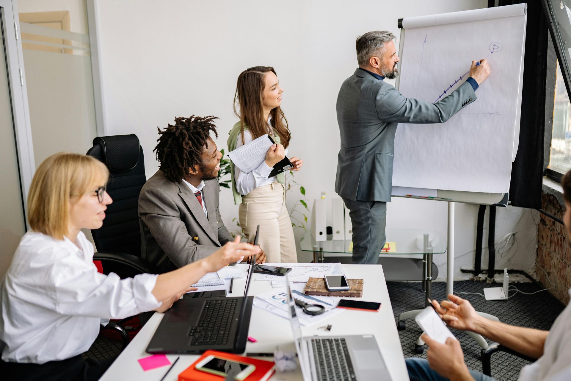 A group of business people are having a meeting in an office.