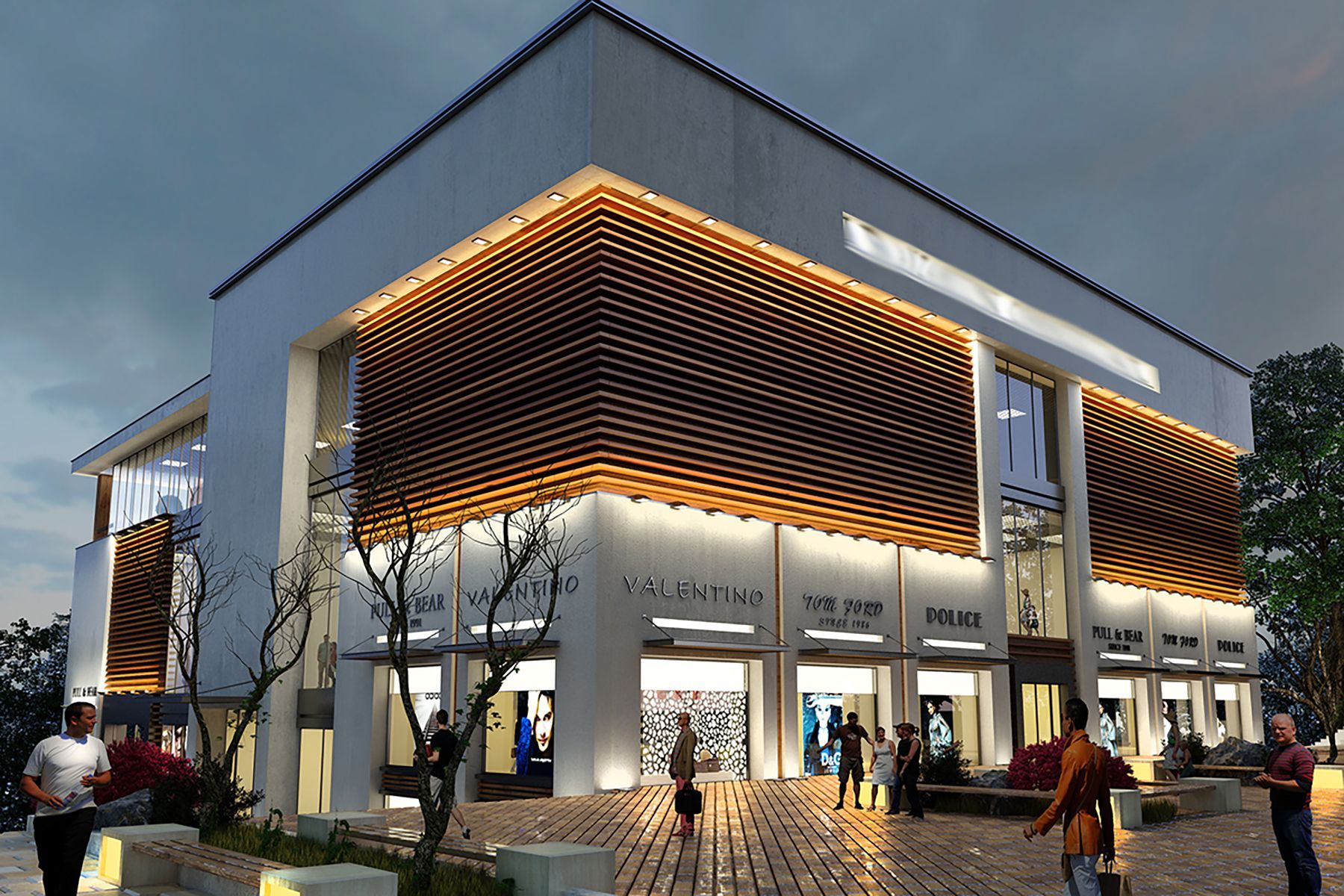 A large white building with a wooden facade is lit up at night.