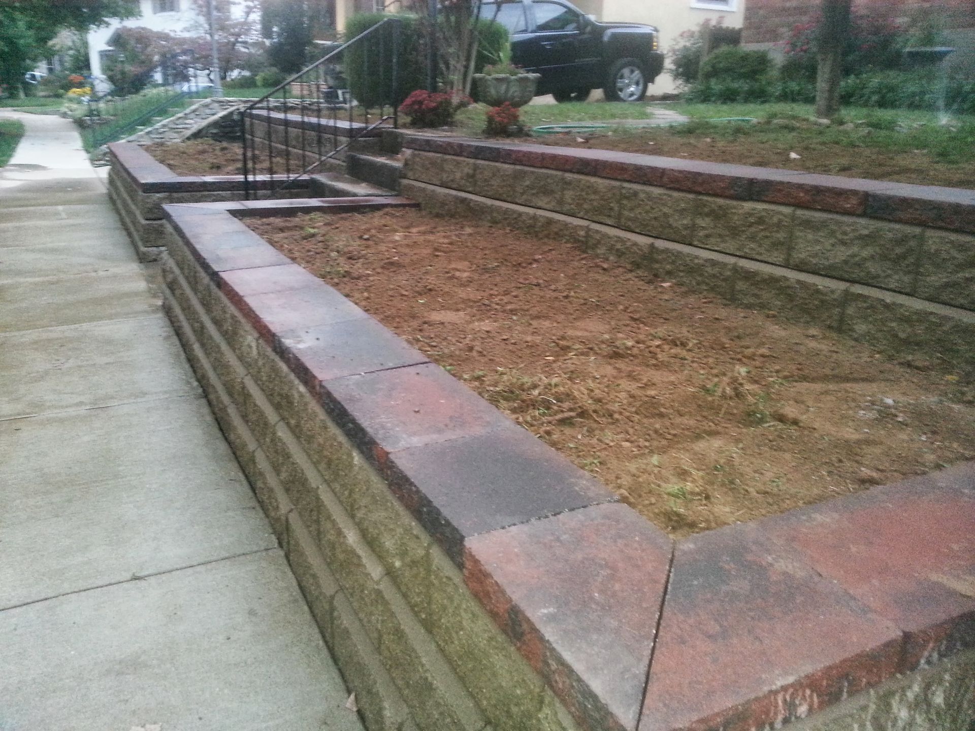 A stone walkway with stairs leading up to a house.