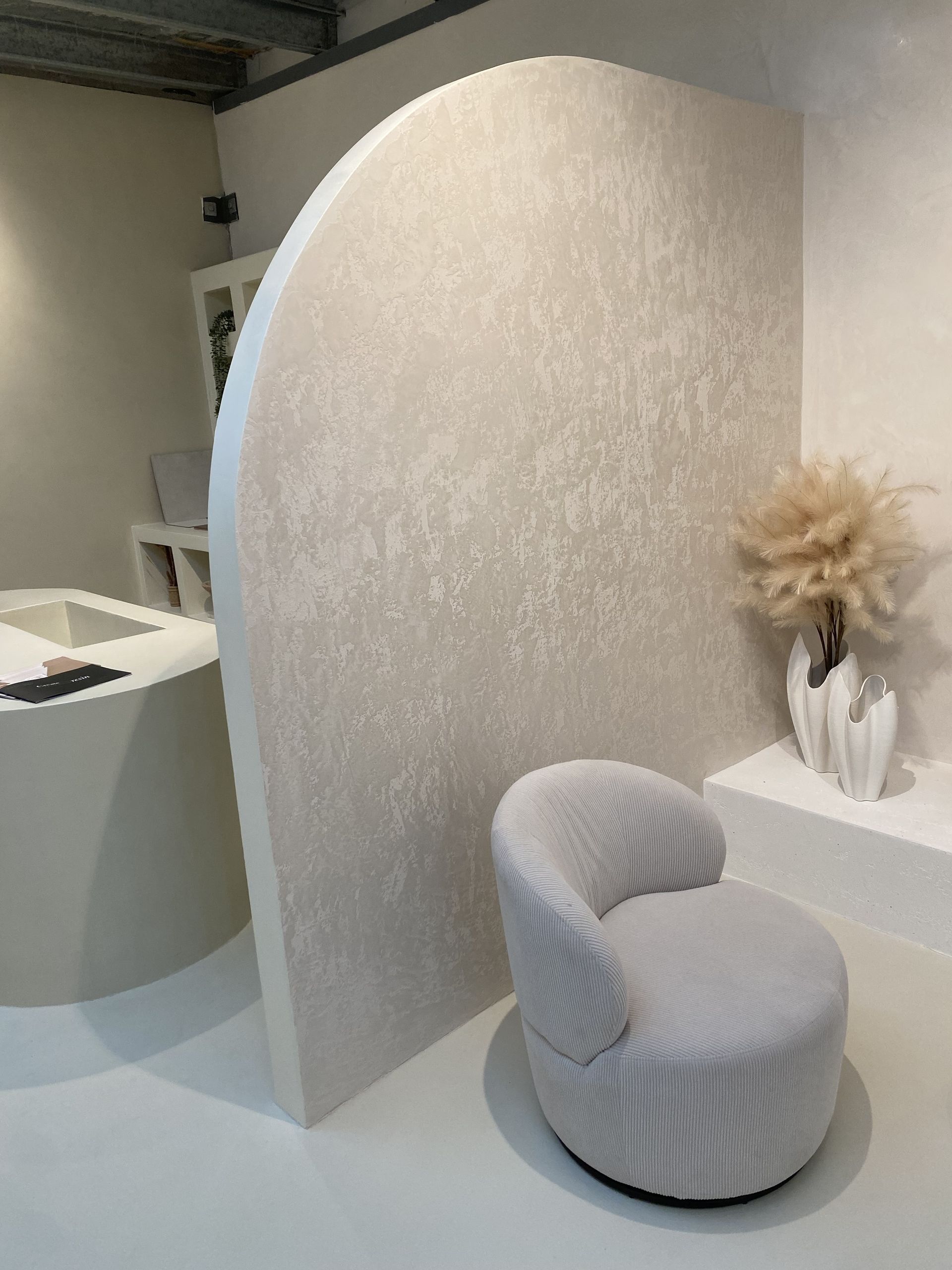 Venetian plaster feature wall with a smooth, polished marble-like finish in a Sydney home