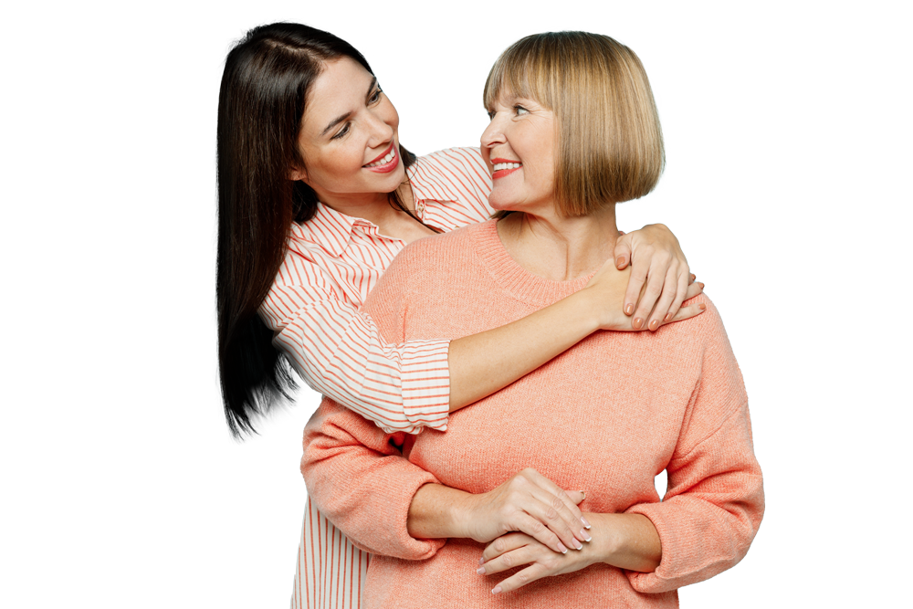 A young woman is hugging an older woman on a white background.