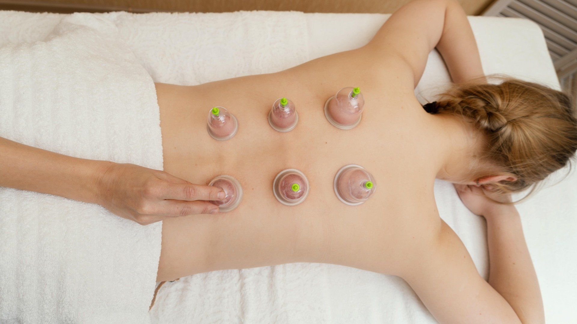 woman-experiencing-cupping-therapy