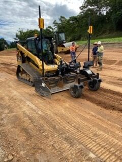 A Bulldozer Is Moving Dirt on A Dirt Road — Terranovus Earthworks & Plant Hire in Cairns, QLD