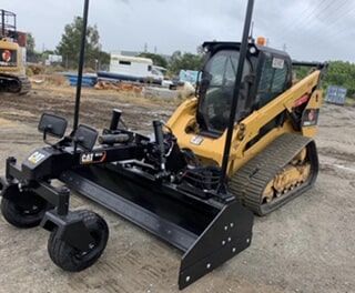 A Yellow and Black Tractor Is Parked in A Dirt Lot — Terranovus Earthworks & Plant Hire in Cairns, QLD
