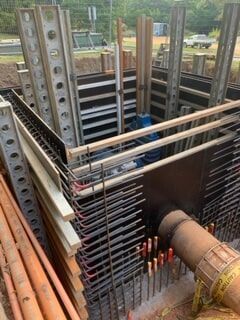 A Large Pipe Is Being Installed in A Construction Site — Terranovus Earthworks & Plant Hire in Cairns, QLD