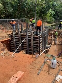 A Group of Construction Workers Are Working on A Construction Site — Terranovus Earthworks & Plant Hire in Cairns, QLD