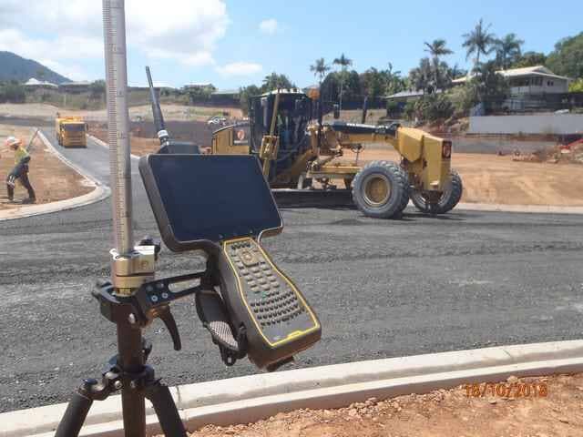 A Phone Is Sitting on A Tripod in Front of A Construction Site — Terranovus Earthworks & Plant Hire in Cairns, QLD