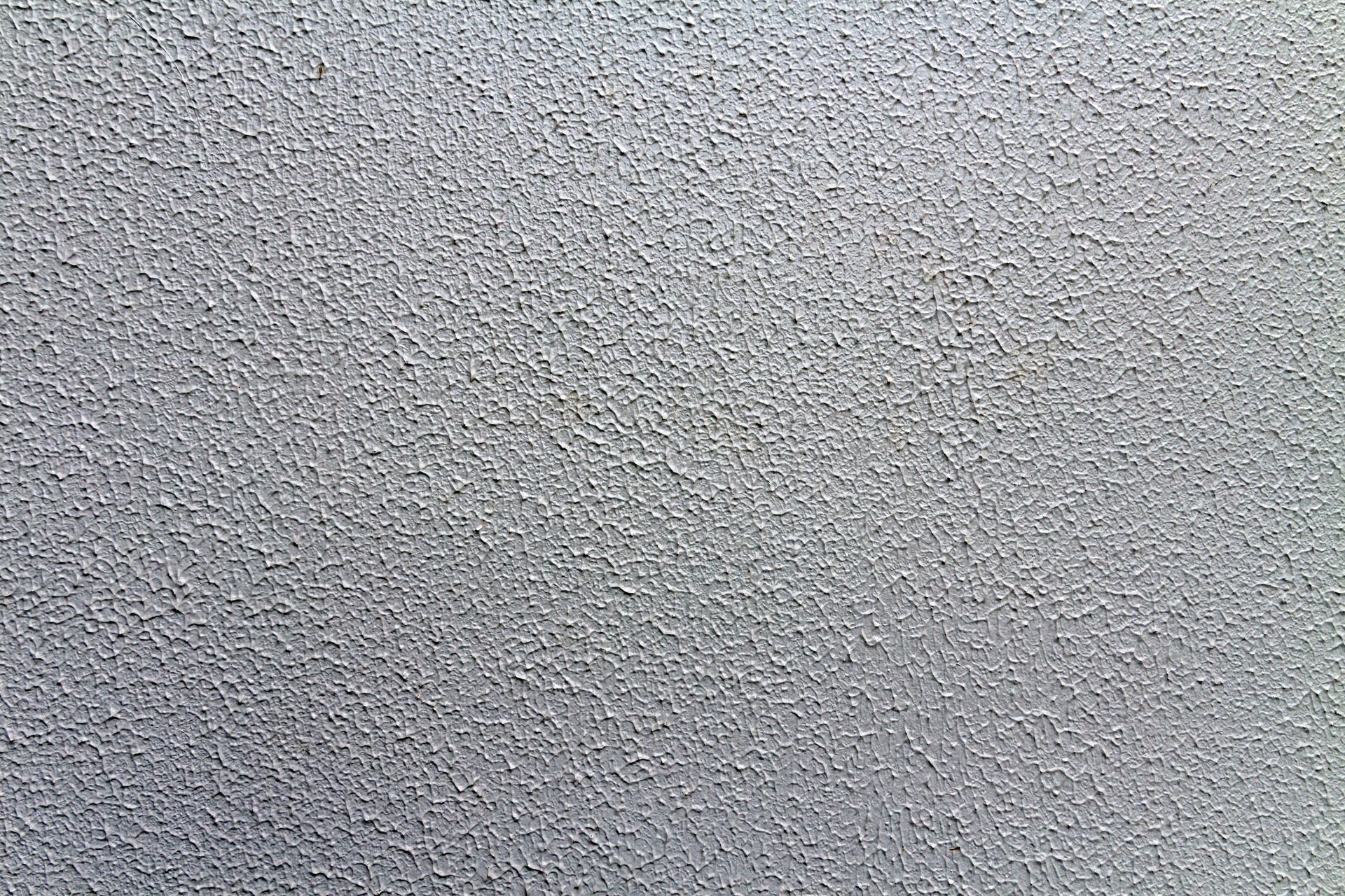 Gray, textured surface with a slightly rough appearance.
