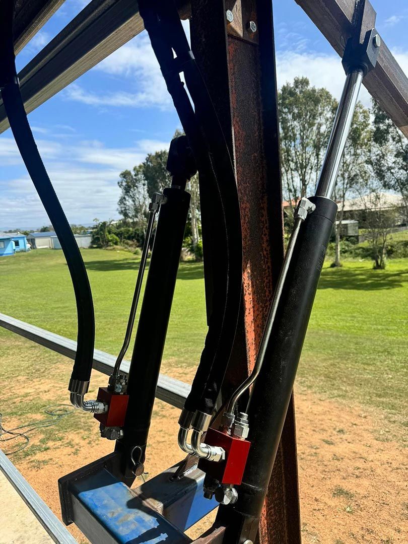 A Close Up Of A Metal Structure With A Hose Attached To It — Townsville Hydraulics In Garbutt, QLD