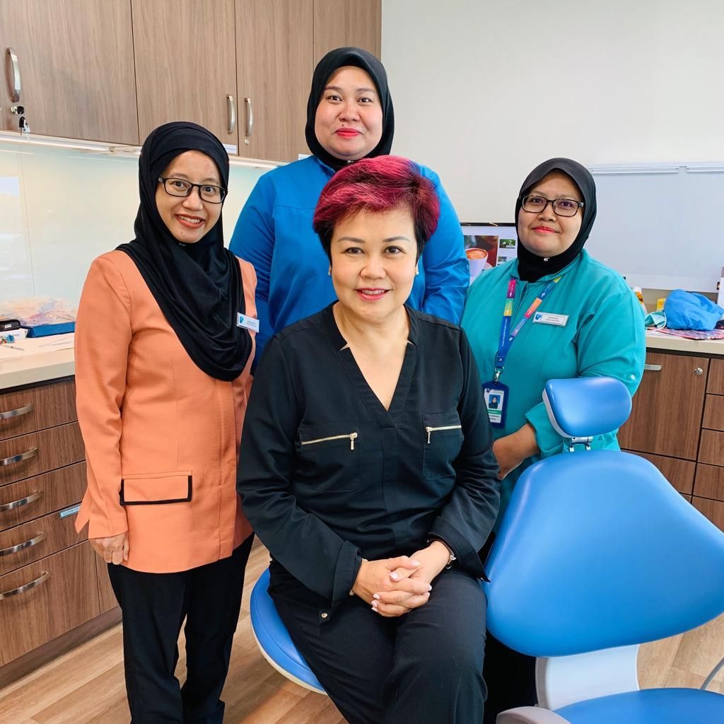 Dr Catherine Lee with her team in Pantai, Malaysia