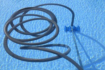 a water hose on the pool