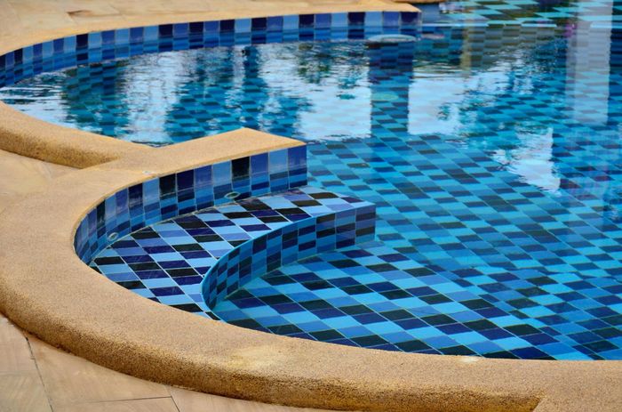 swimming pool of blue and light blue tiles