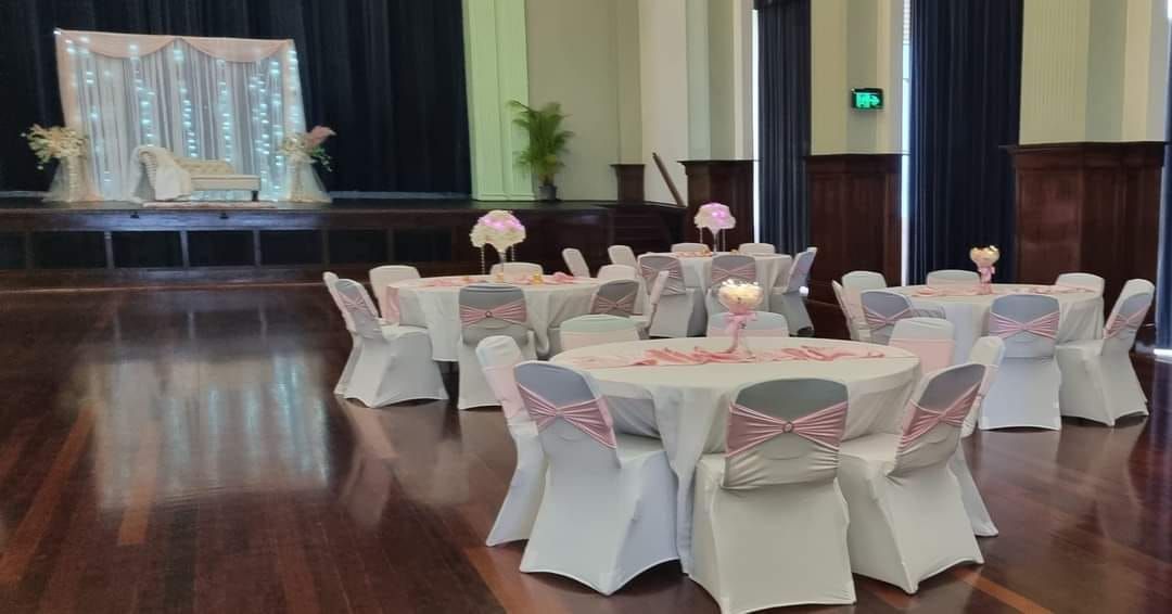 Reception Hall With Round Tables Set for a Celebration — Creative Events Innisfail in Innisfail, QLD