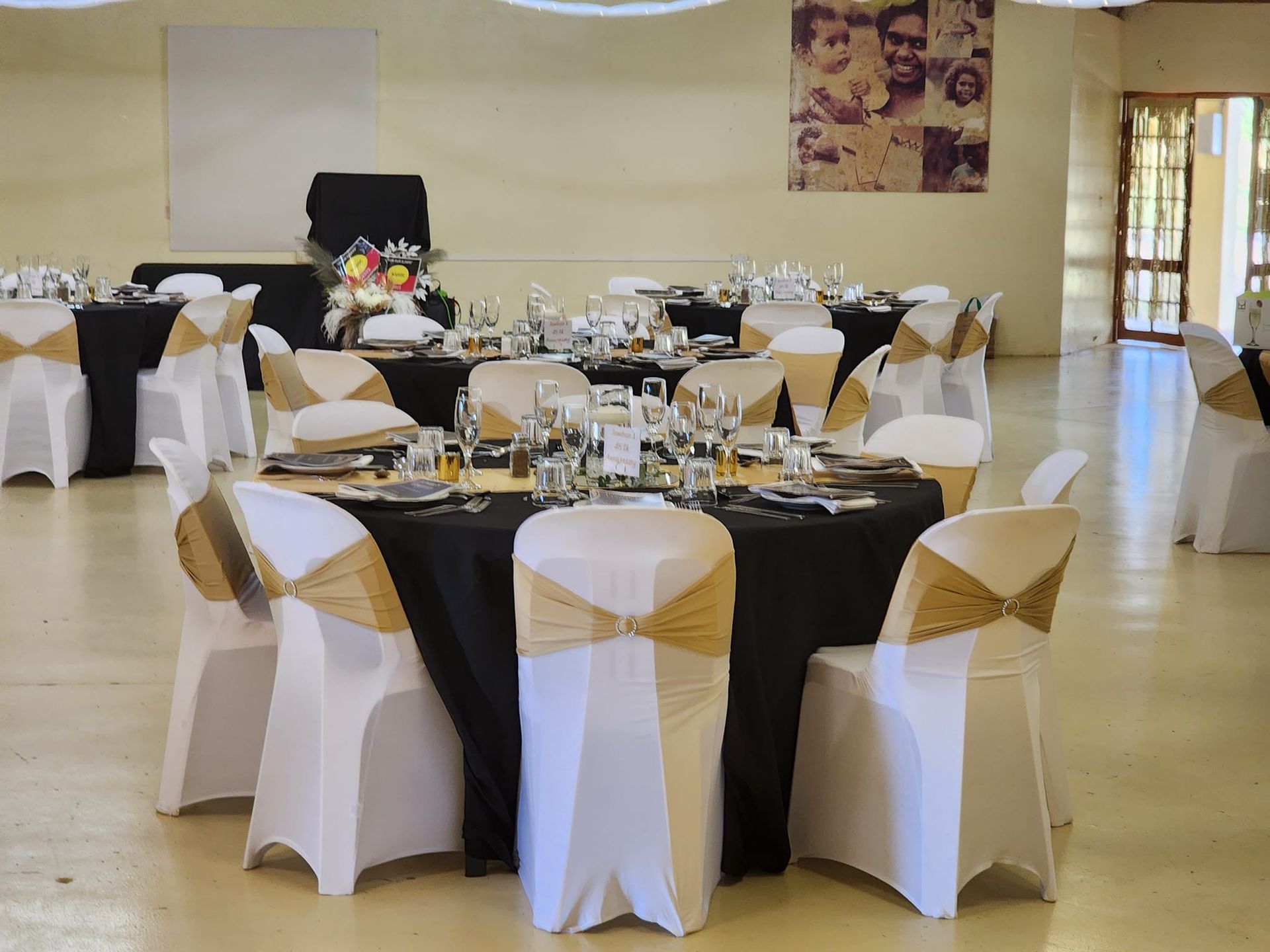 Round Tables Set for a Formal Event, Black Tablecloths — Creative Events Innisfail in Innisfail, QLD