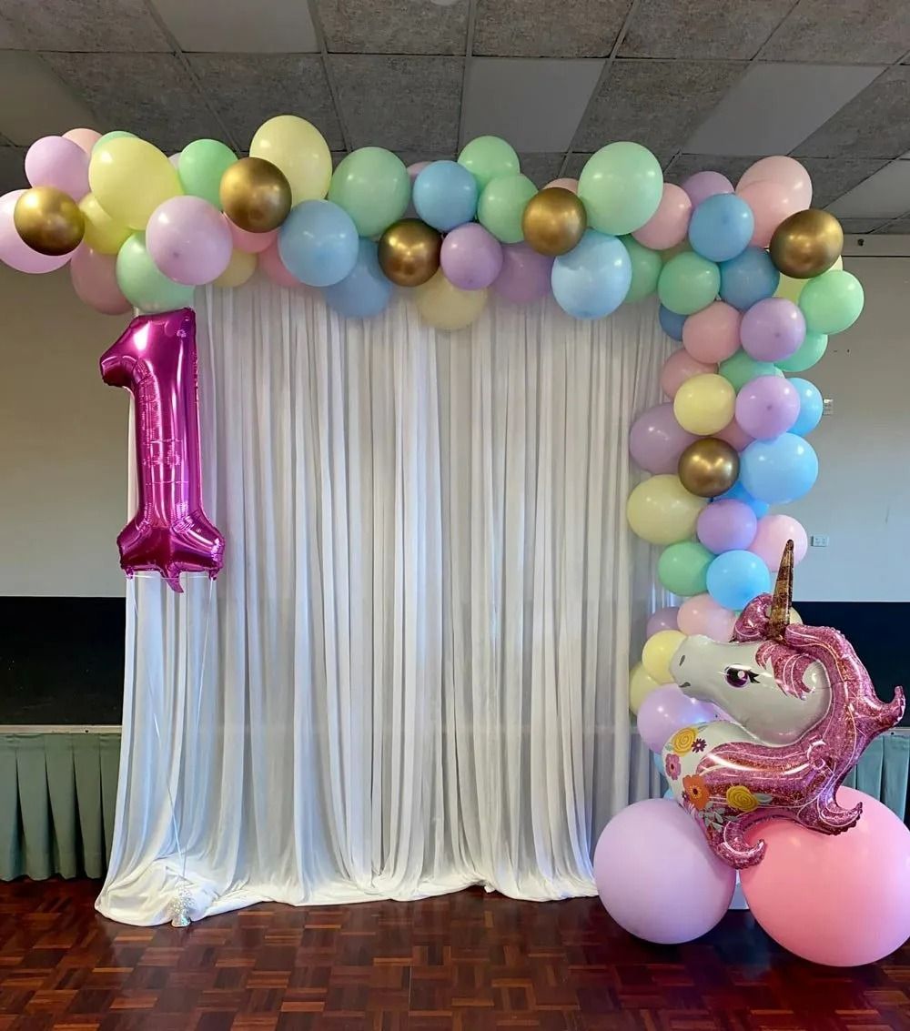 Birthday Party Backdrop With Pastel Balloons and a Unicorn Balloon — Creative Events Innisfail in Innisfail, QLD