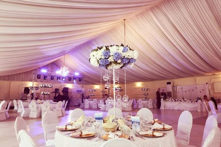 Elegant Banquet Hall With Round Tables Set for a Celebration — Creative Events Innisfail in Innisfail, QLD