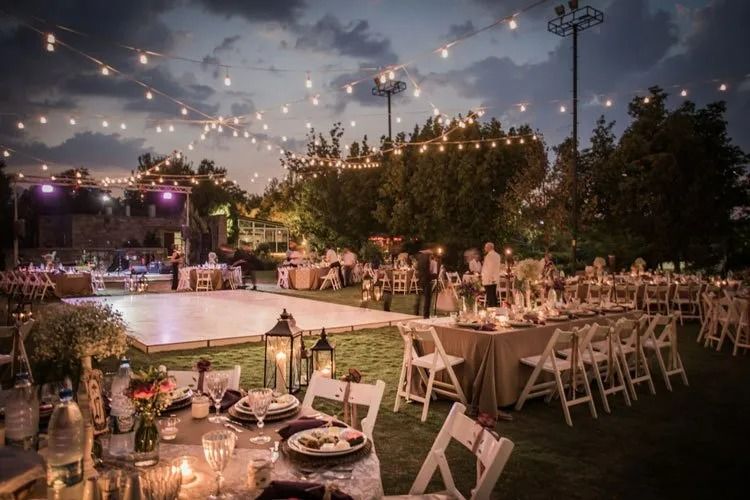 Outdoor Evening Wedding Reception With String Lights — Creative Events Innisfail in Innisfail, QLD