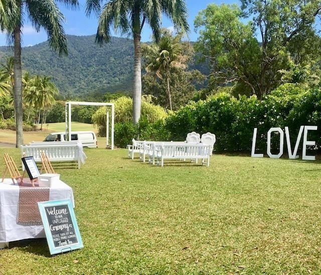 Outdoor Wedding Setup on Green Lawn With Love Letters — Creative Events Innisfail in Tully, QLD