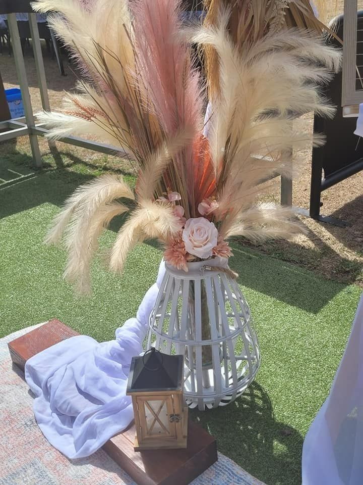 Floral Arrangement in a White Basket Vase on a Picnic Setting — Creative Events Innisfail in Tully, QLD