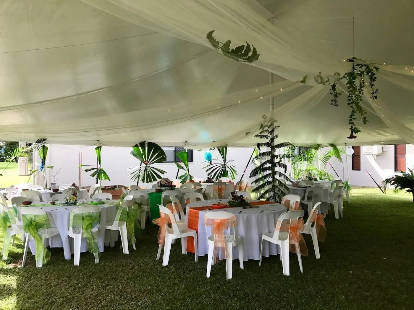 White Tent-covered Party With Round Tables and White Chairs — Creative Events Innisfail in Mission Beach, QLD