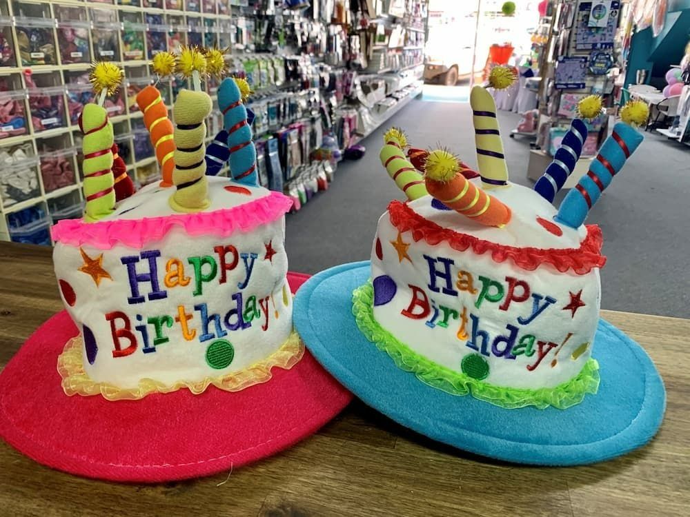 Two Birthday Cake Hats on Display in a Store — Creative Events Innisfail in Tully, QLD