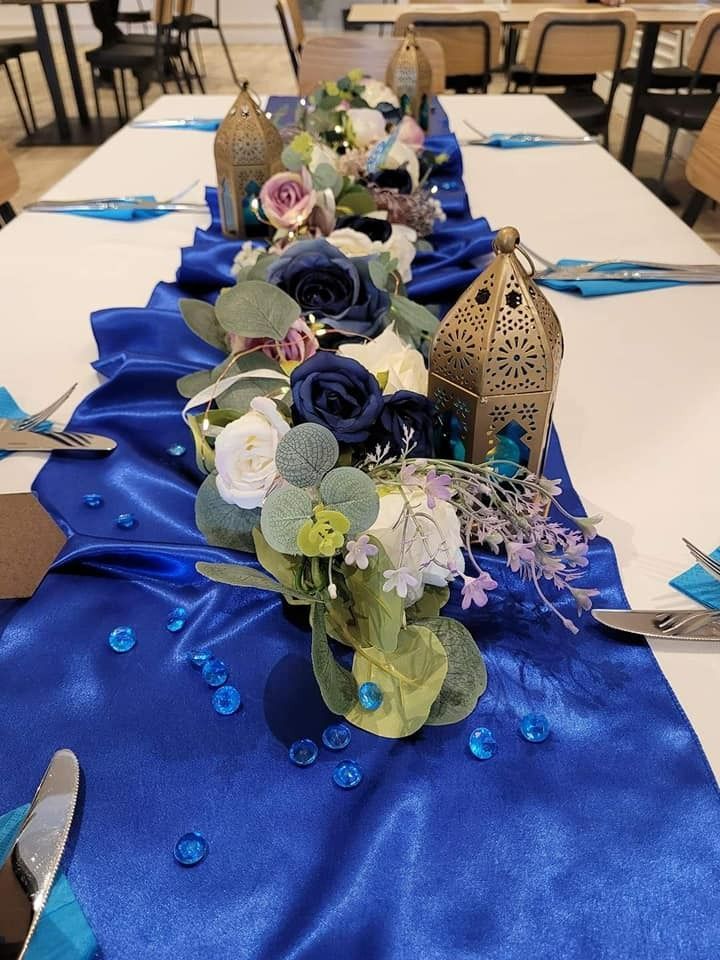 Table Setting With Blue Runner and Floral Centerpiece — Creative Events Innisfail in Innisfail, QLD