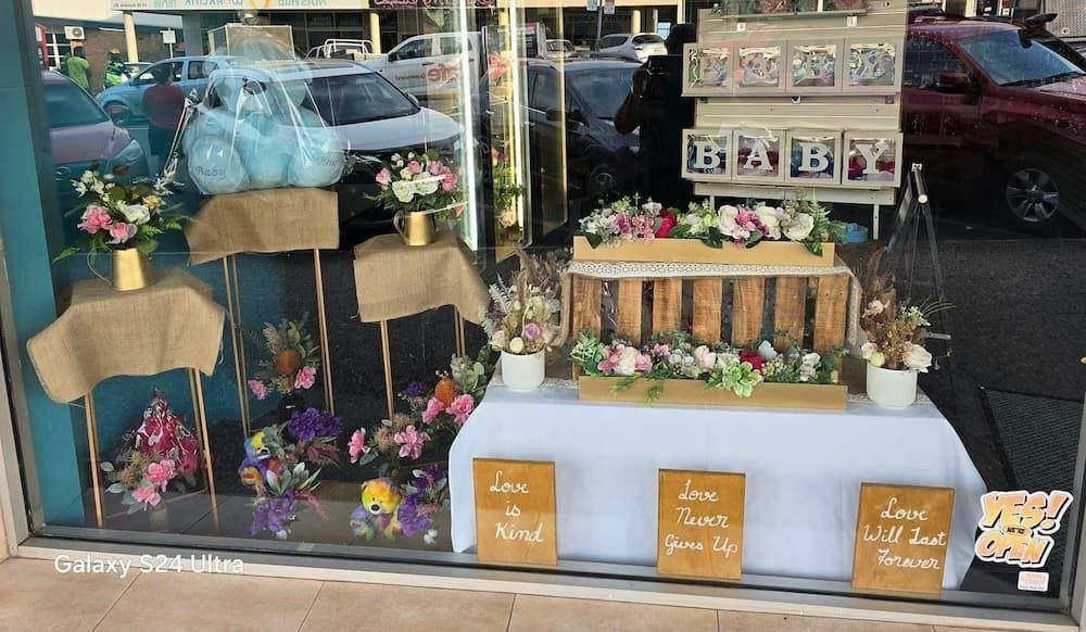 Flower Shop Window Display With Flowers, Burlap, and Signs — Creative Events Innisfail in Innisfail, QLD