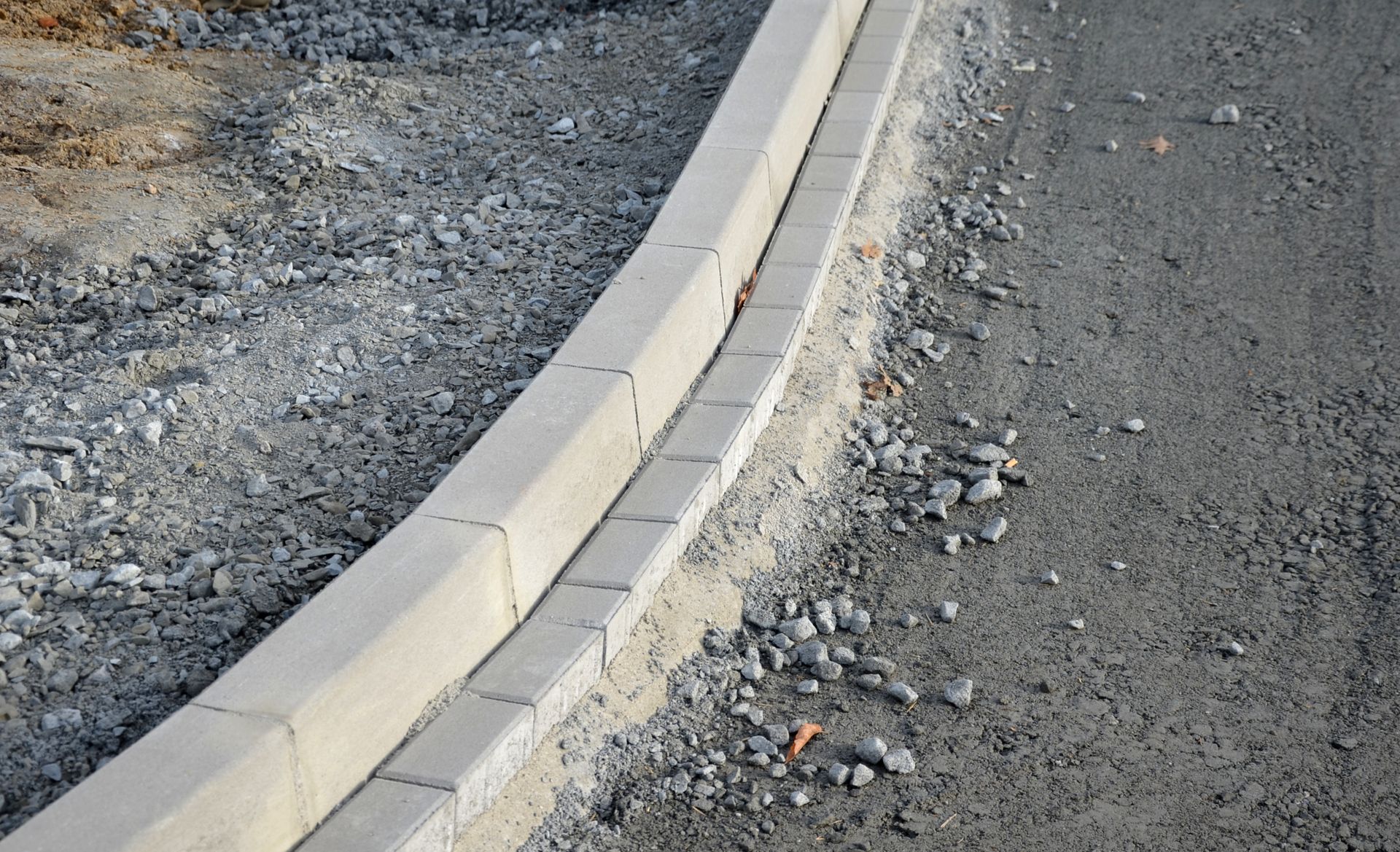 A person is pouring concrete into a concrete floor.