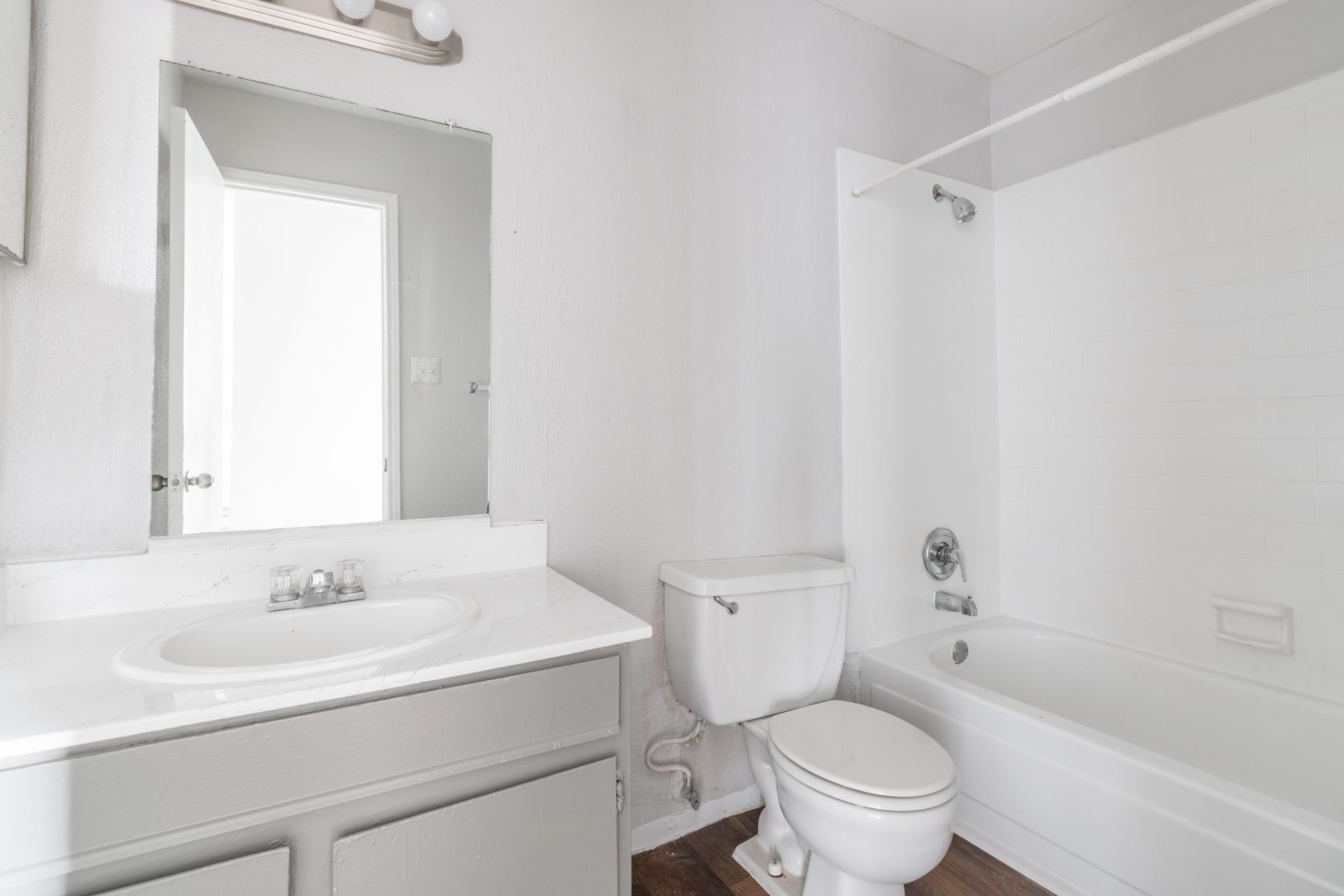 a bathroom with a toilet , sink , and bathtub  located in lake jackson tx 77566