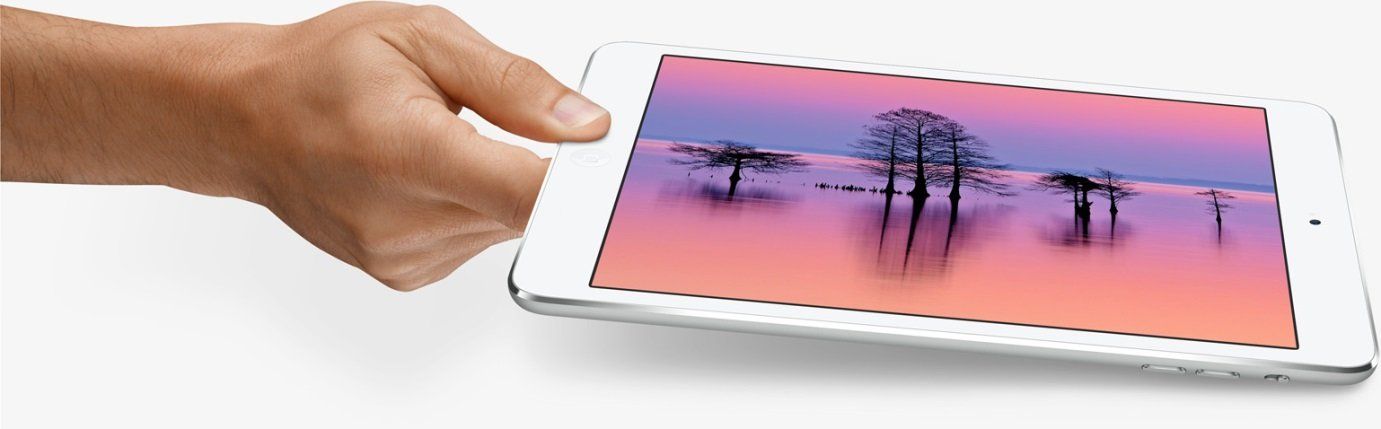 Hand Holding a White Tablet Displaying a Landscape with Trees and Colorful Sky — Wright Partners in Dubbo, NSW