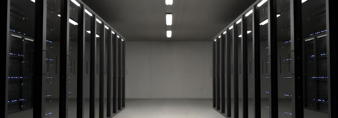 Data Center Hallway with Server Racks. Fluorescent Lights on Ceiling — Wright Partners in Dubbo, NSW