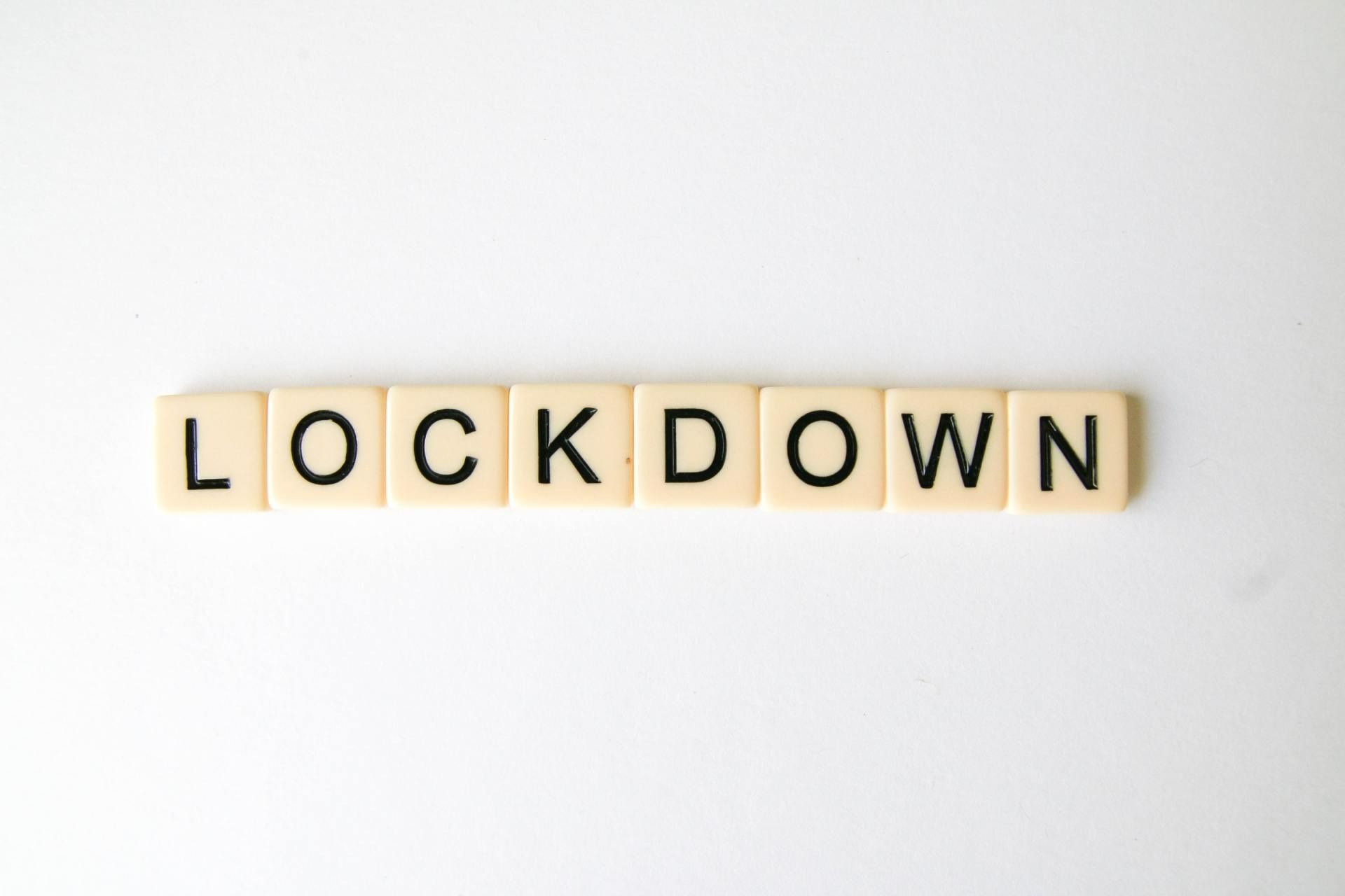 Lockdown Spelled out In Scrabble Tiles on A White Background — Wright Partners in Dubbo, NSW
