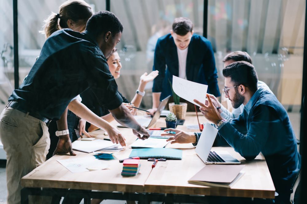 Group of Diverse People Collaborating Around a Table — Wright Partners in Dubbo, NSW