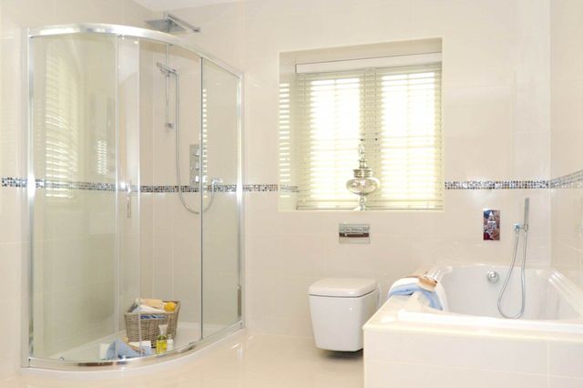 Luxury Bathroom Remodel in Columbia, Missouri, Frameless Glass Shower, Soaker Tub with Roman Faucet, Double Vanity