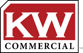 A red and white kw commercial logo on a white background