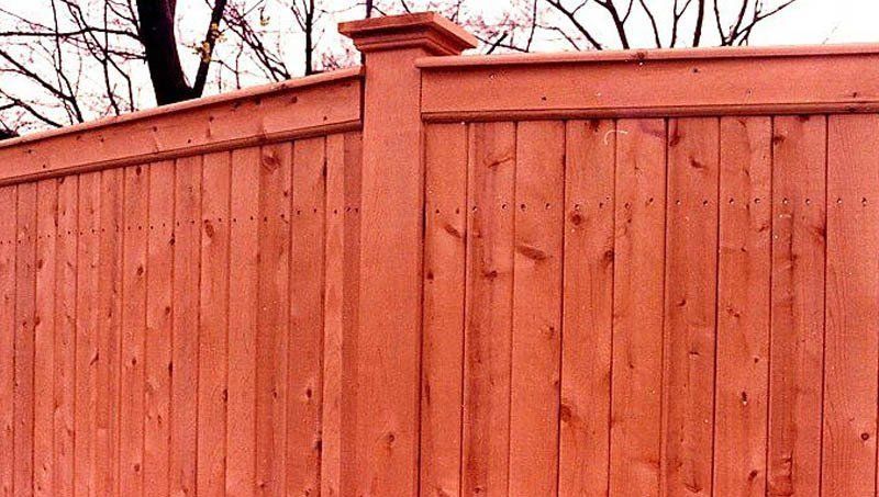 red stained wooden fence