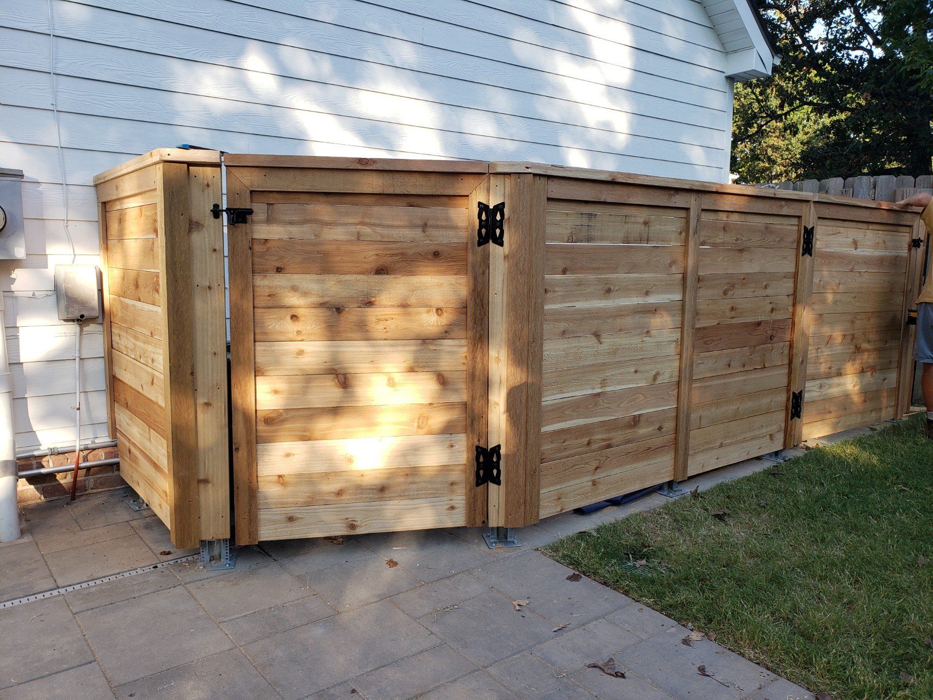 fence surrounding air conditioner